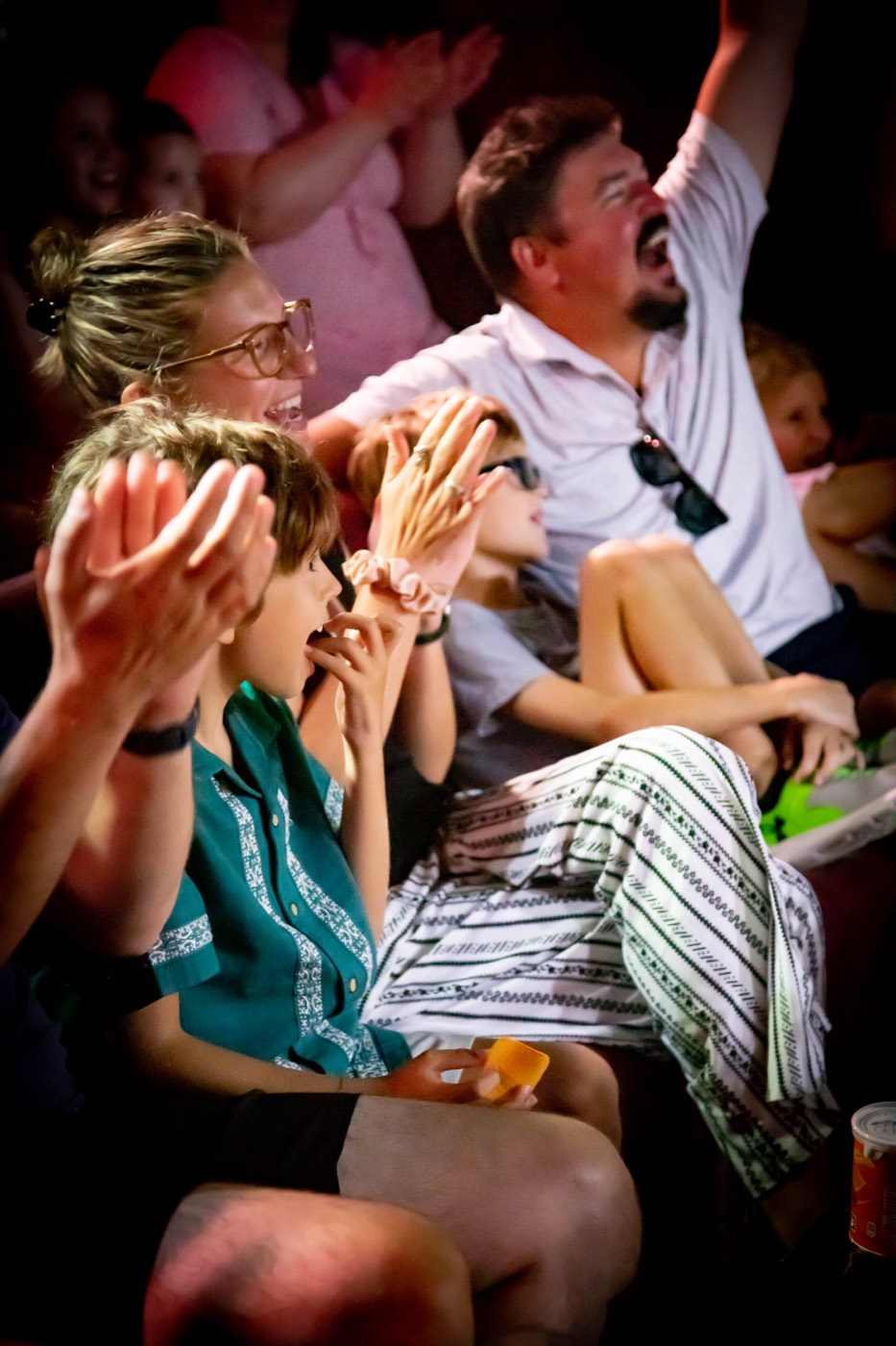 Audience laughing and applauding in the Chamber