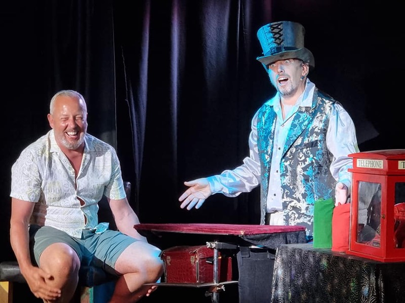 A guest laughing on stage